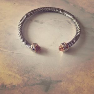 Silver braided bracelet with amber gemstone